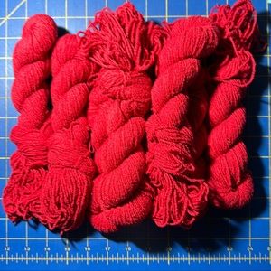 8 skeins of red yarn